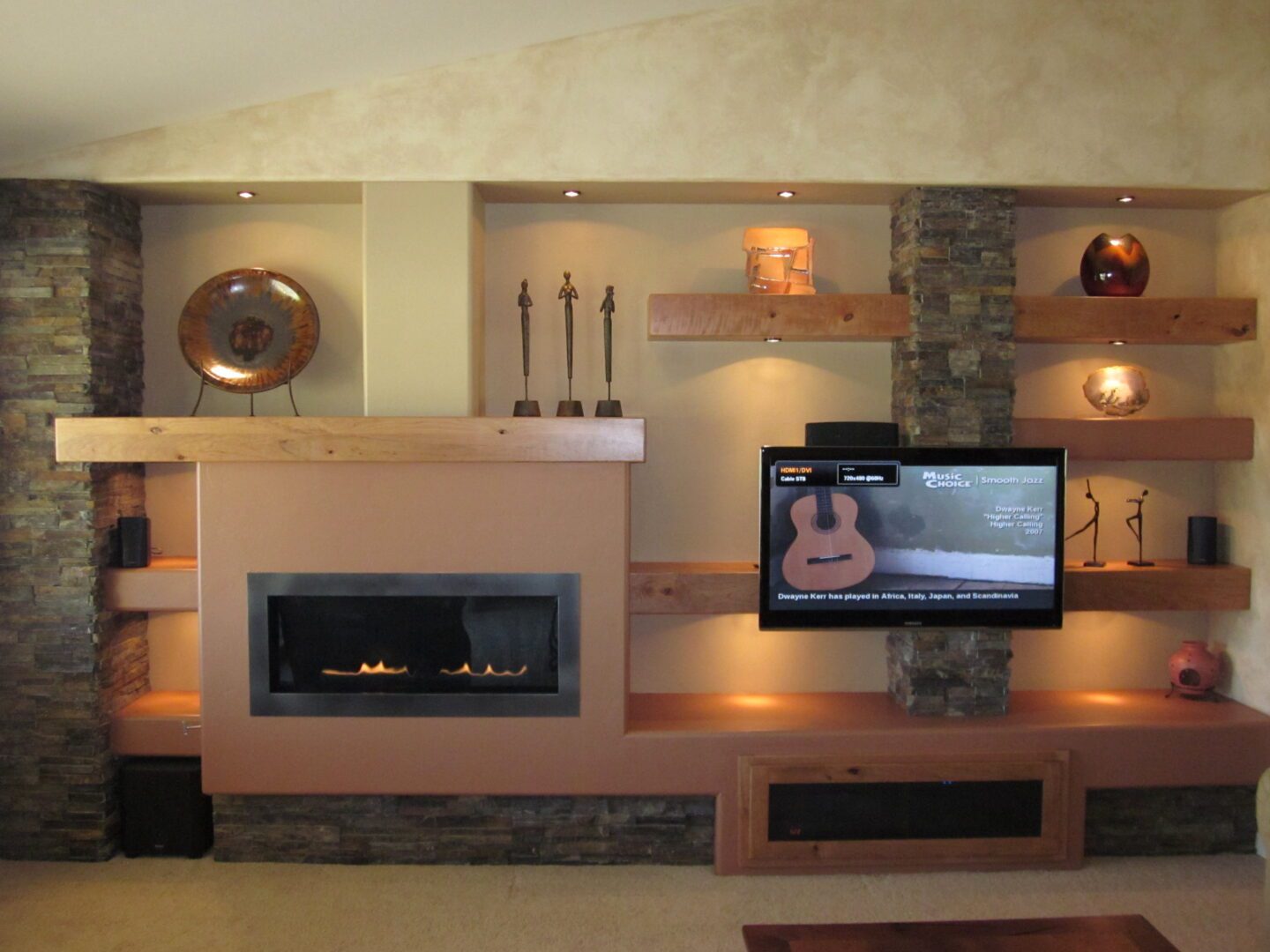 A living room with new fireplace and flatscreen television
